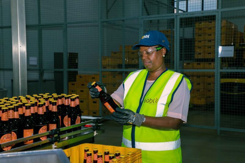 EABL Group CEO Jane Karuku looks at the new cider brand at the company’s microbrewery in Ruaraka.